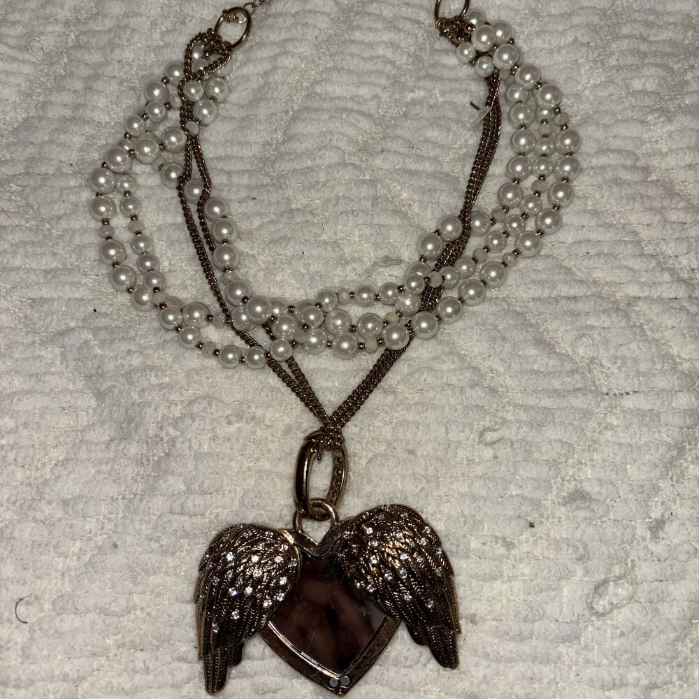 Slightly used Betsey Johnson Floral Satchel and Fly With Me Heart necklace
